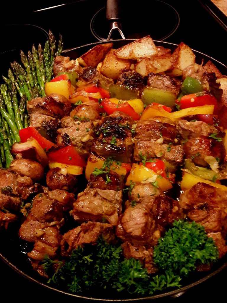 Garlicky Ribeye Steak Kabobs with roasted asparagus and potatoes
