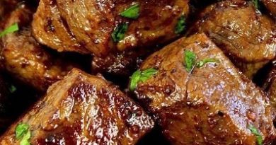 Delicious garlic butter steak bites served on a plate, showcasing the perfect sear, tenderness, and a garnish of fresh parsley.