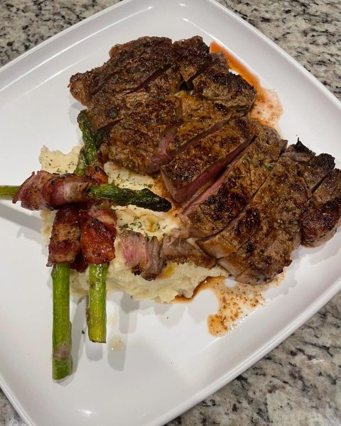 Steak bacon wrapped asparagus and buttered mash
