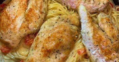 Italian Chicken Pasta: Juicy chicken, al dente spaghetti, and creamy Parmesan sauce on a white plate.