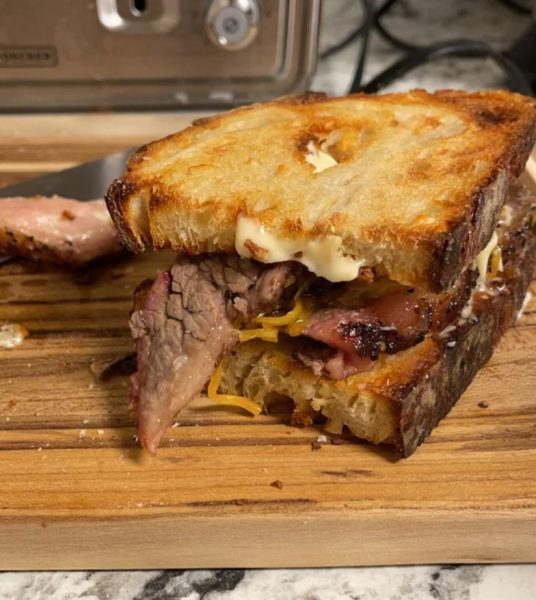 Delicious 12 Hour Oak Smoked Brisket Sandwich on Freshly Baked and Toasted Cheese Sourdough Bread