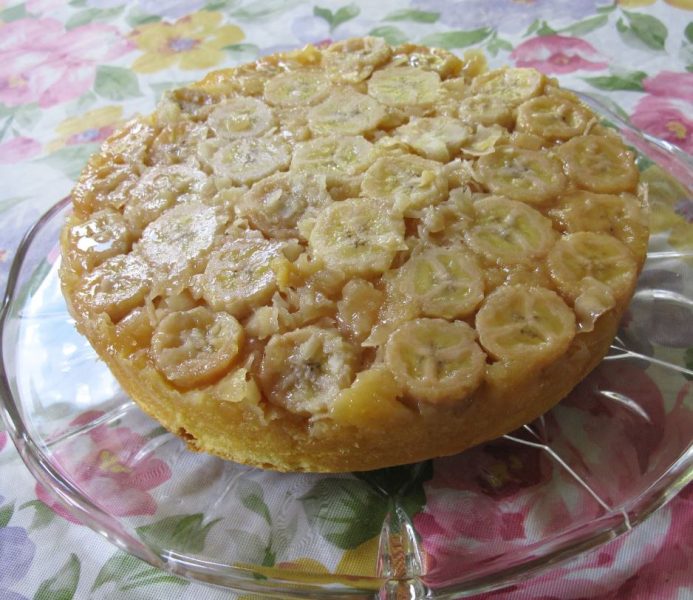 A slice of delicious Banana Coconut Upside Down Cake on a plate
