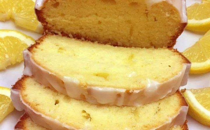 "Delicious Lemon Loaf showcased on a white plate, embodying the perfect balance of moist texture and citrus zest."