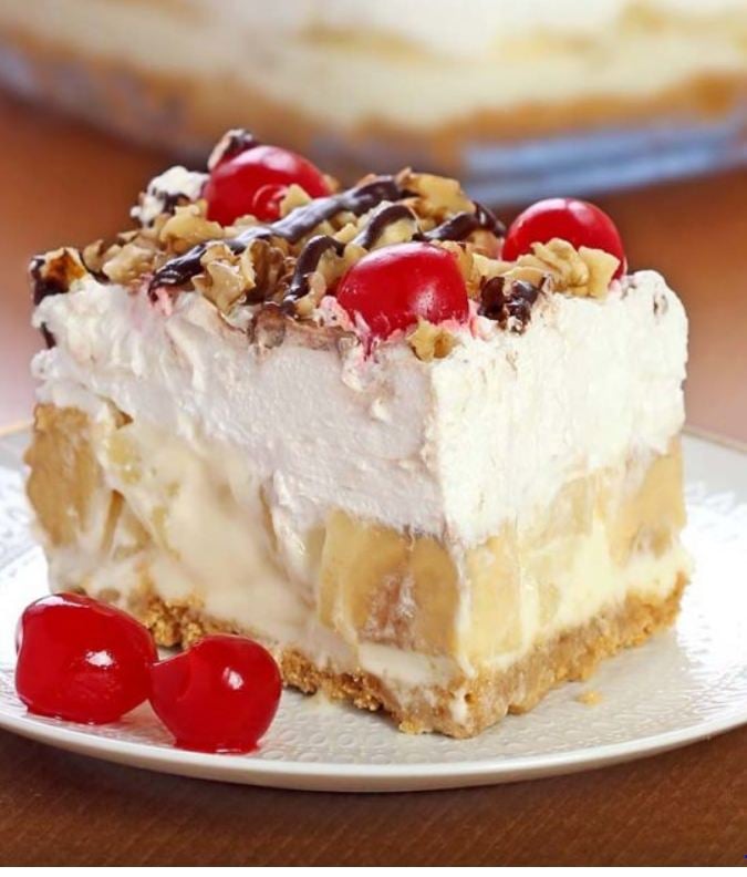 A no bake banana split dessert cut into slices and served on a plate