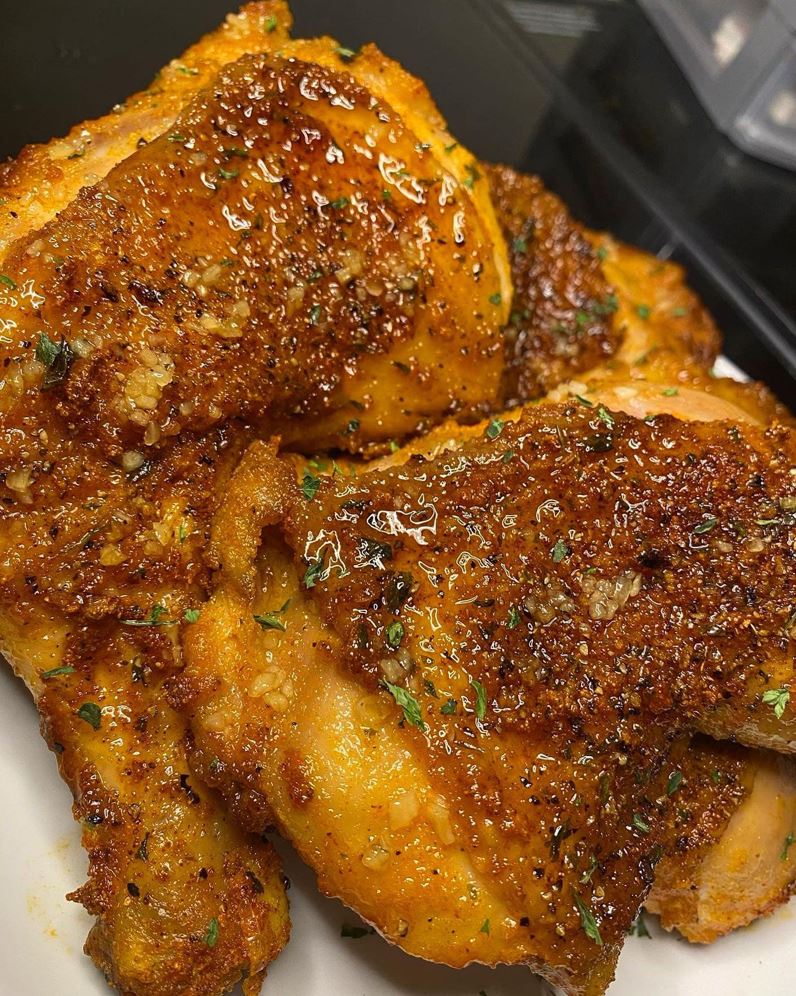 A plate of golden brown, extra crispy honey baked chicken