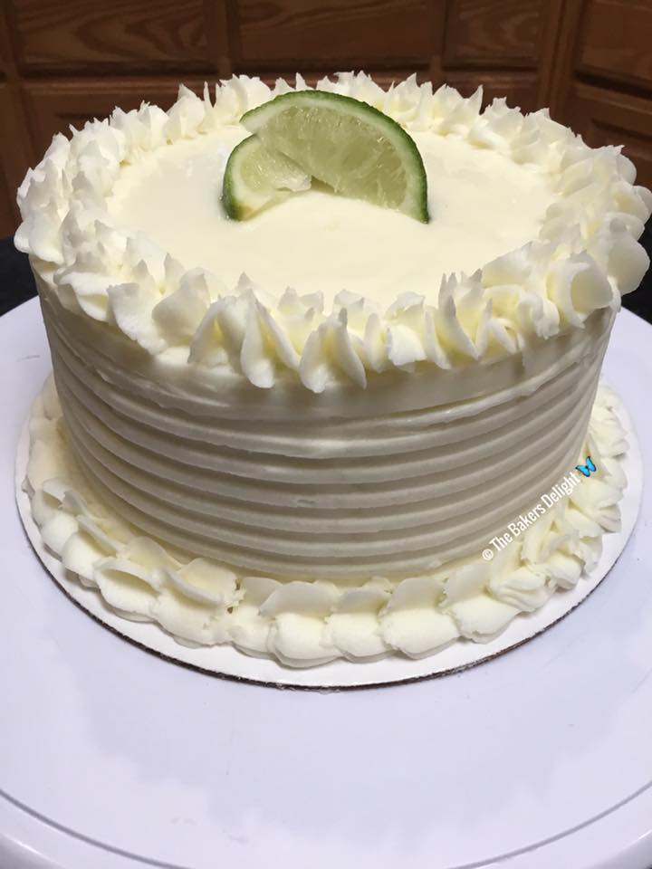 A beautifully decorated Key Lime Cake with creamy Key Lime Cream Cheese Frosting
