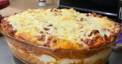 "Million Dollar Spaghetti Casserole - A tantalizing blend of al dente spaghetti, savory ground beef, creamy cheeses, and golden Cheddar topping.