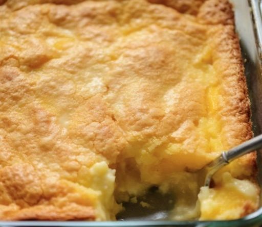 4 Ingredients Lemon Cream Cheese Dump Cake - A slice of deliciousness on a plate.