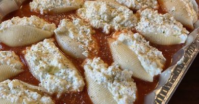 Stuffed Shells Recipe showcasing jumbo pasta shells filled with a rich blend of ricotta, mozzarella, and Parmesan, topped with melted cheese and fresh basil.