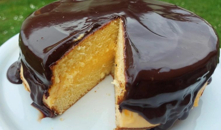 Boston Cream Pie - A masterpiece of moist cake, luscious pastry cream, and chocolate ganache, perfect for indulgent dessert lovers.