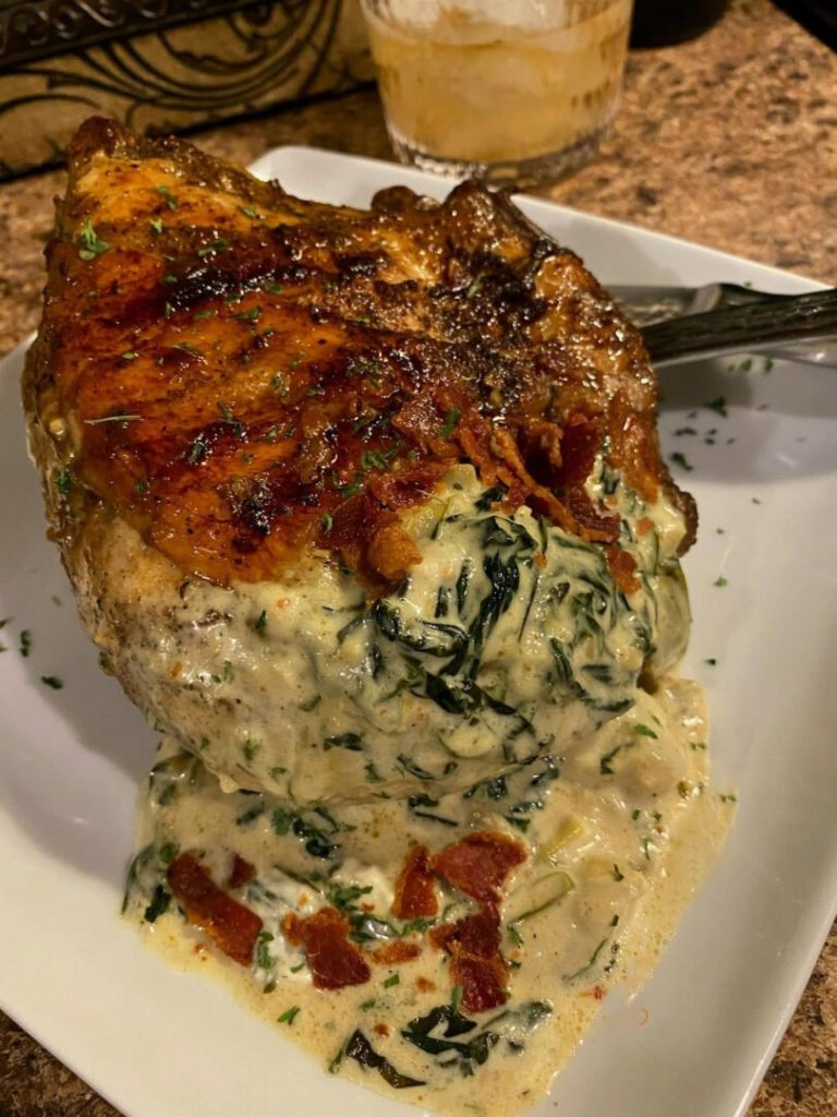 Chicken Breast Stuffed With Hot Bacon – Crispy golden brown chicken adorned with a spinach and artichoke cream, a feast for the senses.