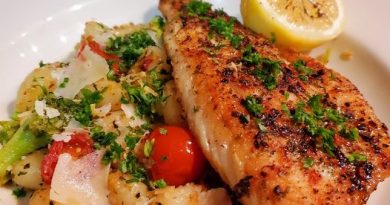 Plated Pan Seared Branzini and Gnocchi with vibrant cherry tomatoes