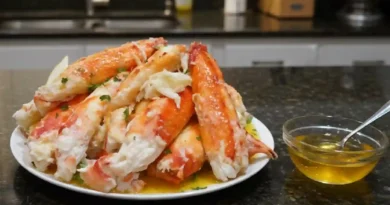 "Golden brown Fried King Crab Legs with Garlic Butter on a plate, showcasing the crispy exterior and tender Alaskan King Crab meat inside."