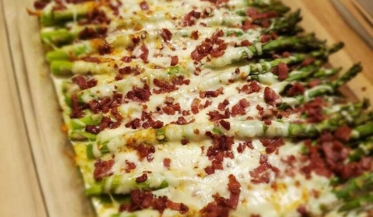 Cheesy Asparagus Casserole in a baking dish, ready to serve.