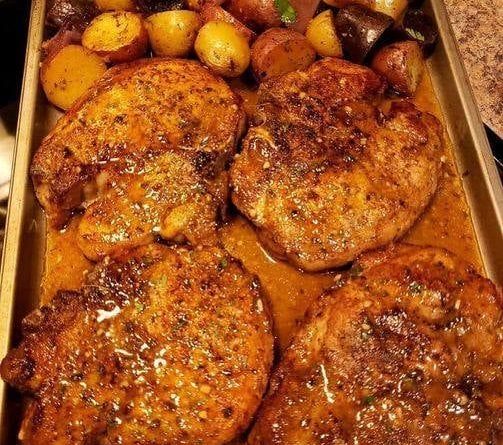 Sheet pan pork chops with multi-colored potatoes and red onion