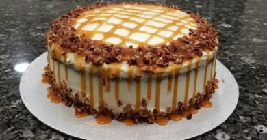 A slice of buttered pecan caramel cake on a plate