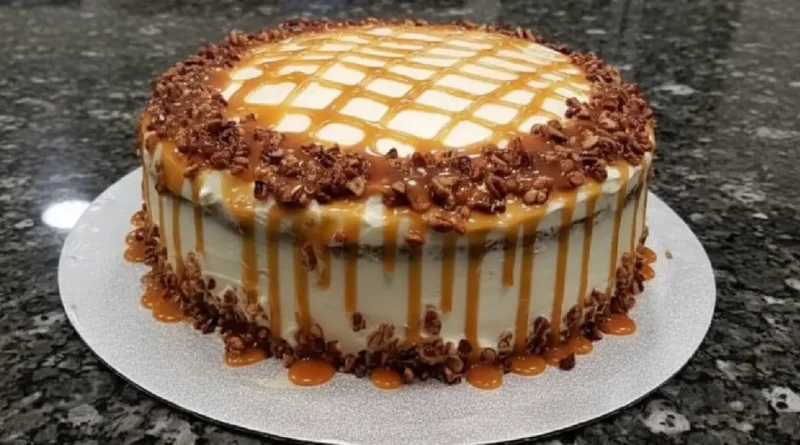 A slice of buttered pecan caramel cake on a plate
