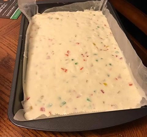 Four ingredient nougat bars arranged on a plate with a sprinkle of powdered sugar.