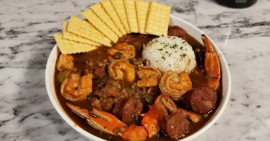 Seafood Gumbo Recipe - A medley of shrimp, crab, crawfish, and Andouille sausage in a rich broth, served over steamed rice.