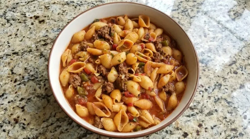 "Delicious Pasta Shells with Ground Beef served in a white baking dish"