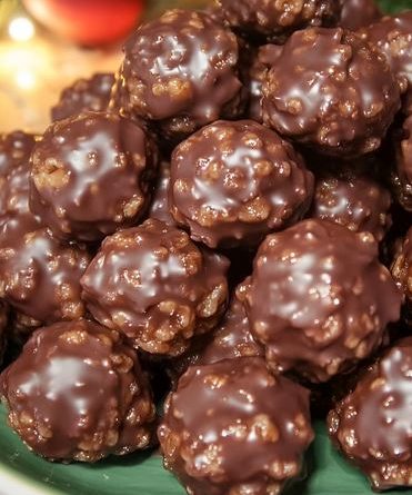 Chocolate Rice Krispie Balls - A plate filled with chocolate-covered rice krispie balls.