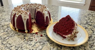 A slice of red velvet cake on a plate with a fork