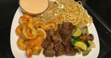 Close-up of a bowl of homemade hibachi with chicken, onions, and bell peppers