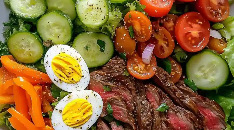 Salad with lettuce, cucumbers, tomatoes, boiled eggs, carrots, peppers, onions and sautéed thinly sliced ribeye steak