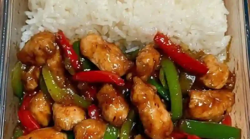 Sizzling garlic chicken stir fry with peppers and steamed rice